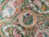 a plate with a floral design on it sitting on a table