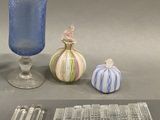 a lot of glass items that are on the table