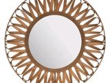 un miroir rond en bois avec un cadre en métal