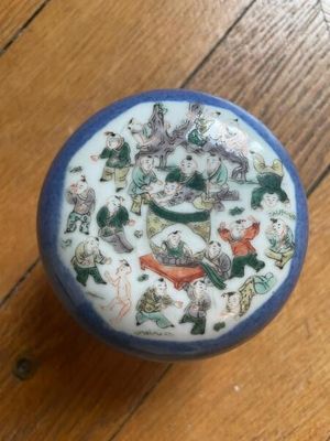 a small blue and white bowl on a wooden table