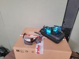 a box with a pair of sunglasses and a cell phone on top of it
