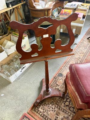 a chair and a table in a room with a lot of furniture