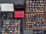 a lot of pins in a case on the table
