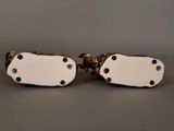 pair of white and brown porcelain figurines of a man and a woman