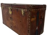an old trunk that is sitting on a white surface