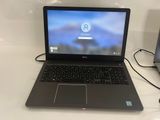 a laptop computer that is sitting on a table