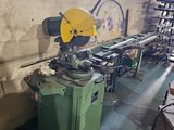a machine that is sitting in a room with a lot of tools