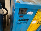 a blue machine that is sitting next to a yellow machine