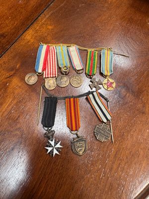a table with a lot of medals and medals on it