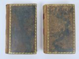 pair of antique leather bound books on white background