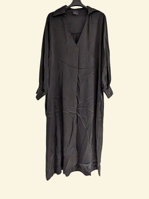 an image of a black dress hanging on a hanger
