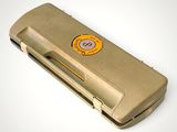 a tan case with a yellow sticker on it