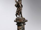 an image of a bronze statue of a woman on a pedestal