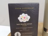 a box of hair density serum next to a box of hair care products