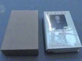 a book that is sitting on a table next to a box