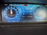 the dashboard of a car with a digital display on it