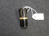 a ring that is sitting on top of a black object