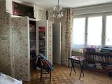 a bedroom with a bed and a desk in it