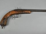 an old gun that is on display on a table