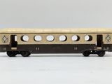 a close up of a toy train car on a white surface