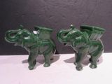 paire d'éléphants en céramique verte portant des paniers sur le dos