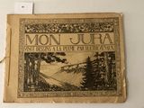 un vieux livre sur lequel figure l'illustration d'un paysage de montagne