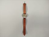an image of a watch hanging on a wall with a white background