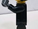 a black and white lego man with a white helmet