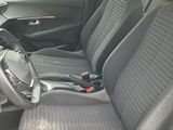 the interior of a car with two black seats and a steering wheel