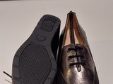 they are two pairs of shoes that are on a white surface