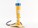 an image of a yellow and blue light sitting on top of a wooden stand
