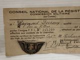 un vieux document sur lequel figure l'image d'un insigne militaire