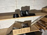 a shelf that has a coffee maker and other items on it