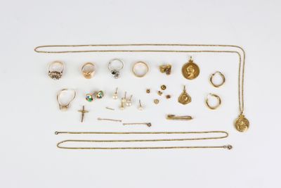 a close up of a bunch of jewelry on a white surface