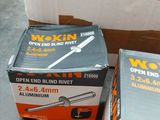 two boxes of woodworking tools sitting on a table