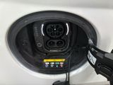 a car plugged up with a charger attached to it