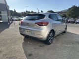 the rear end of a silver car parked in a parking lot