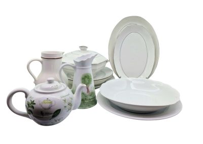 a lot of white plates and cups on the table