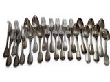 a lot of silver spoons and forks on a white surface