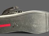 a close up of a pair of shoes on a gray surface