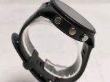 a smart watch that is on display on a stand