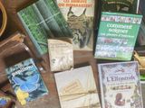 many books on a table with a cup of coffee