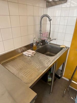 a kitchen with a sink and a counter in it