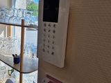 a room with a desk, chair, and a window