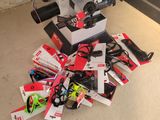 a pile of skis and snowboards on the floor