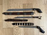 several different types of knives on a wooden floor next to each other