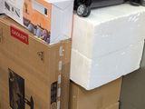 a stack of luggage sitting on top of a cardboard box