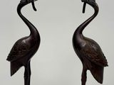 pair of bronze flamingo candlesticks with birds on them
