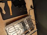 a stove top with a pan and a spatula on it