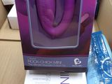 packaging of a purple sex toy in a cardboard box on a table
